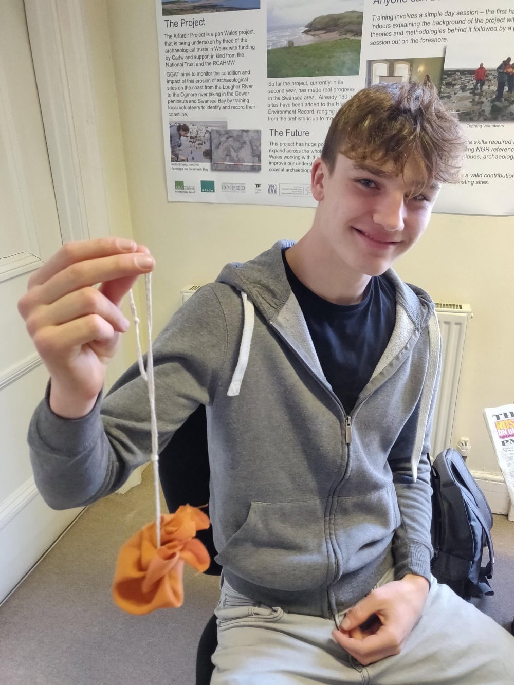 Person holding homemade bag with string