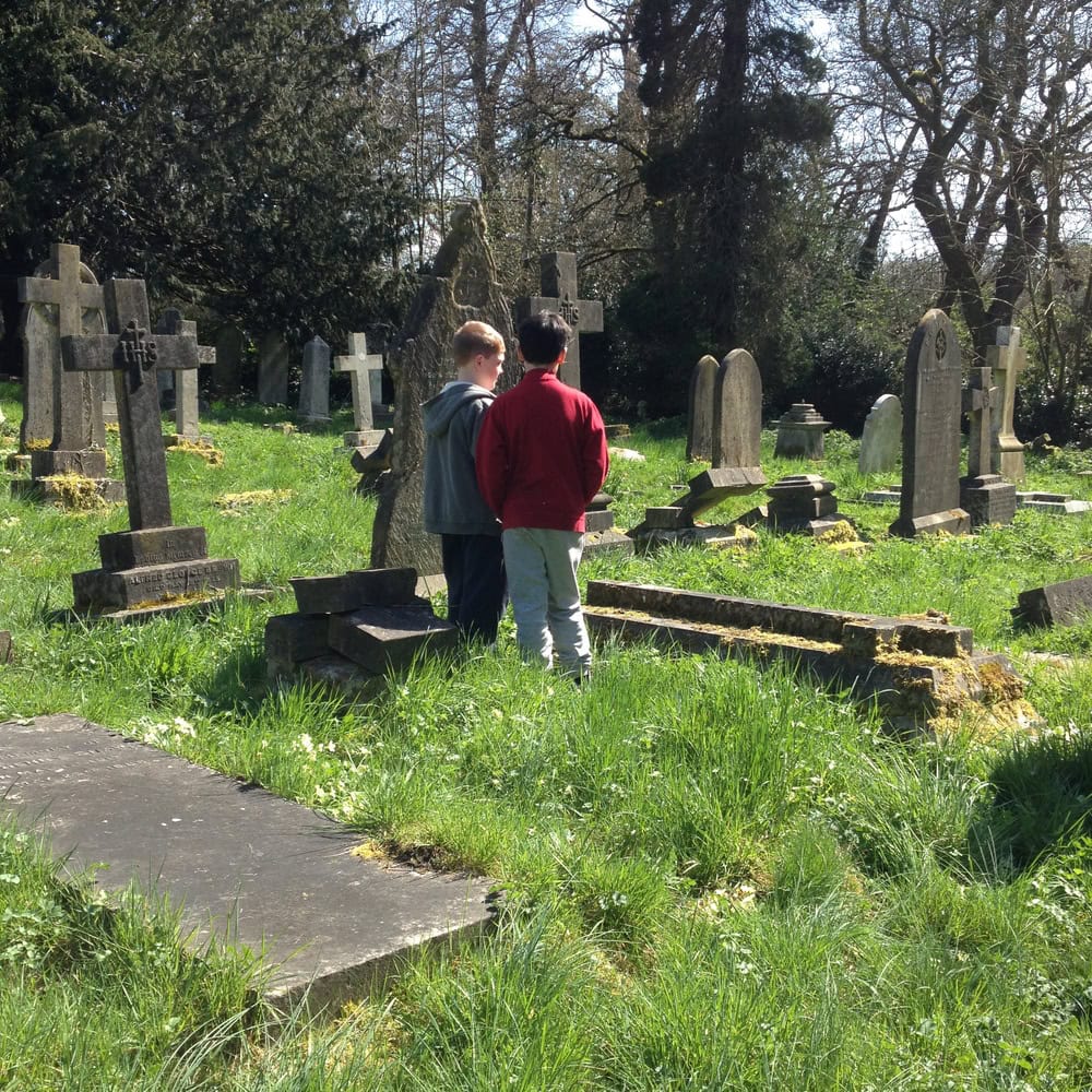 Two children in a church cemetary
