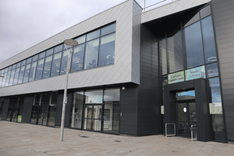 A modern library building with sign reading 'Neath Library'