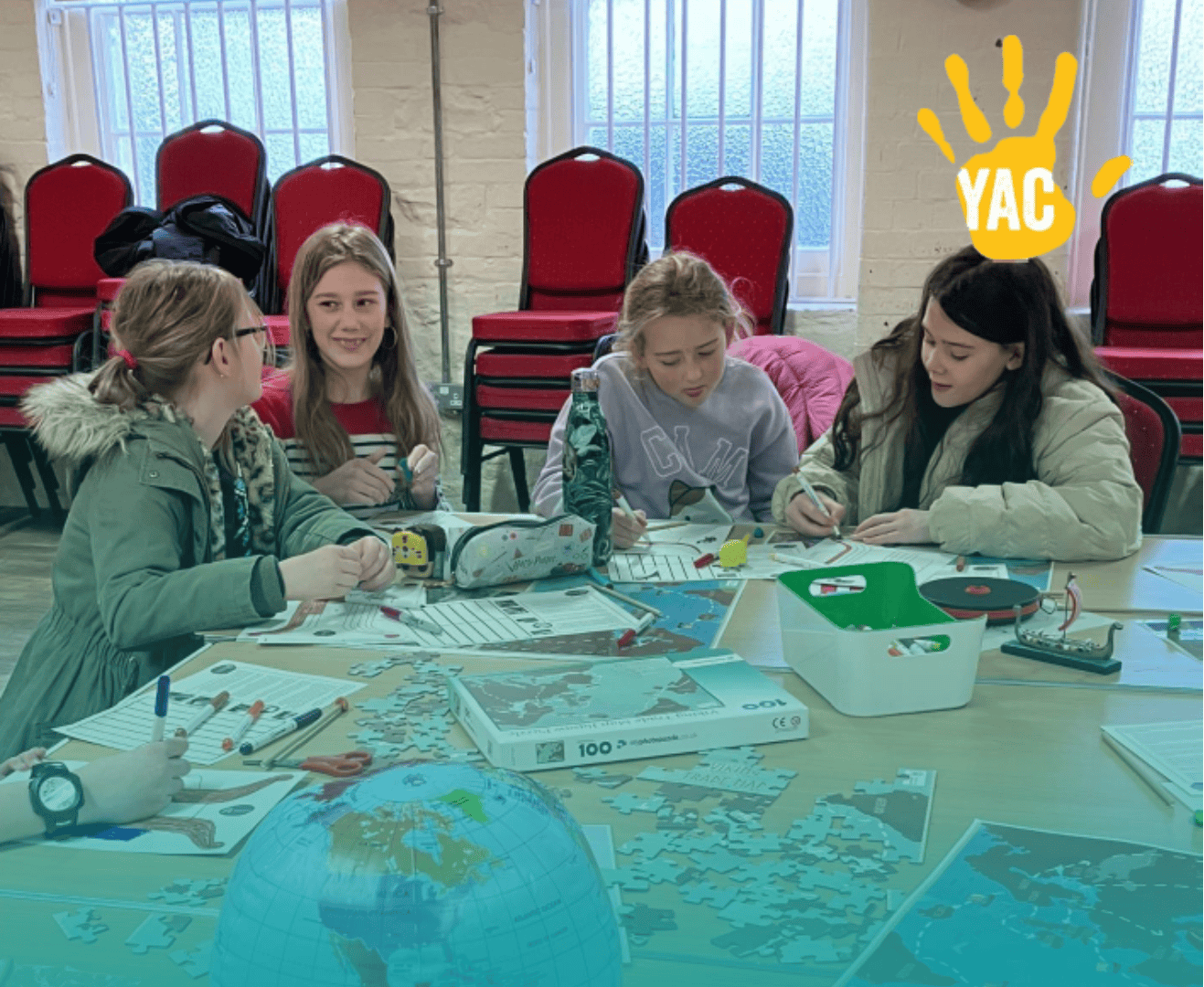 Four young people taking part in a YAC activity.