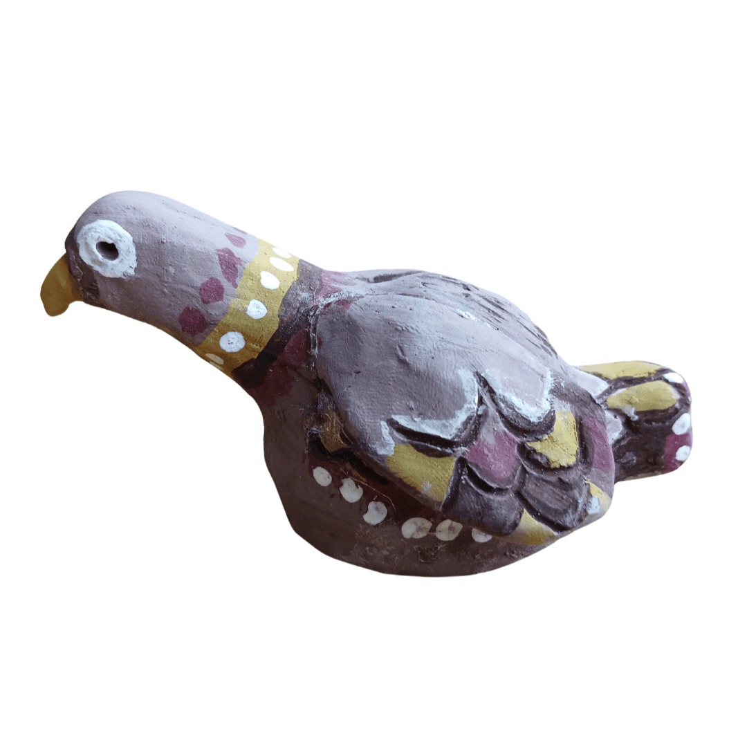 Small model grey bird made from clay with colourful yellow and pink decorations on it's feathers.