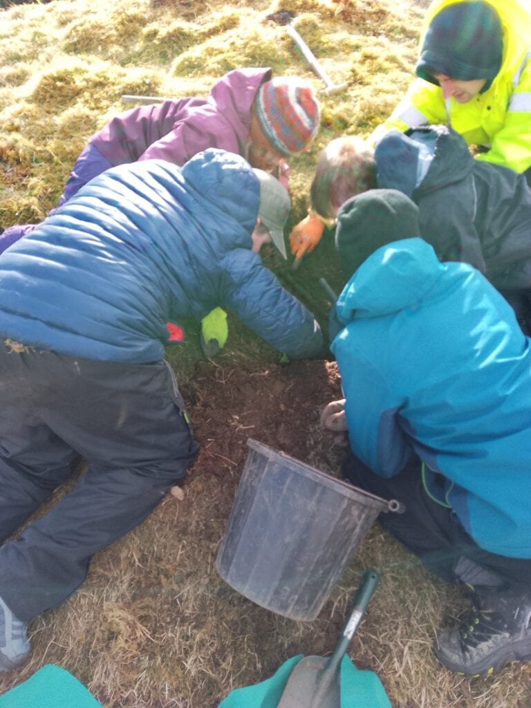 A group of young people on an archaeological dig