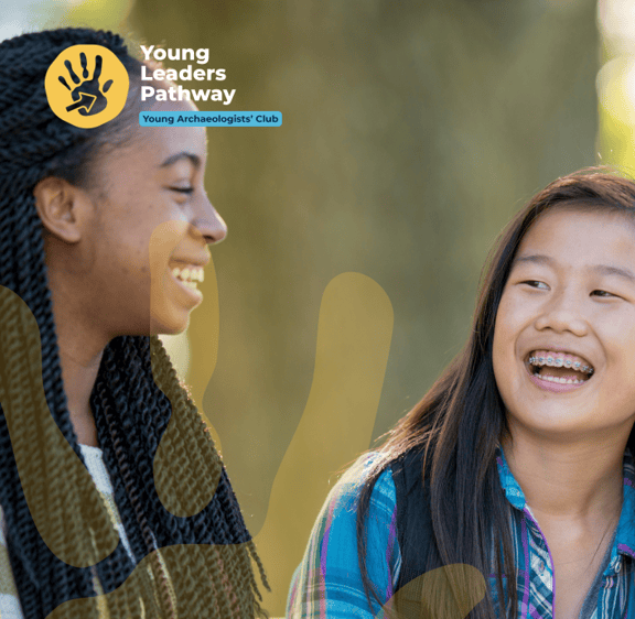 Two young people laughing with YAC hadn evident