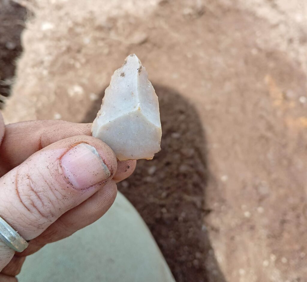 A small prehistoric flint arrowhead.