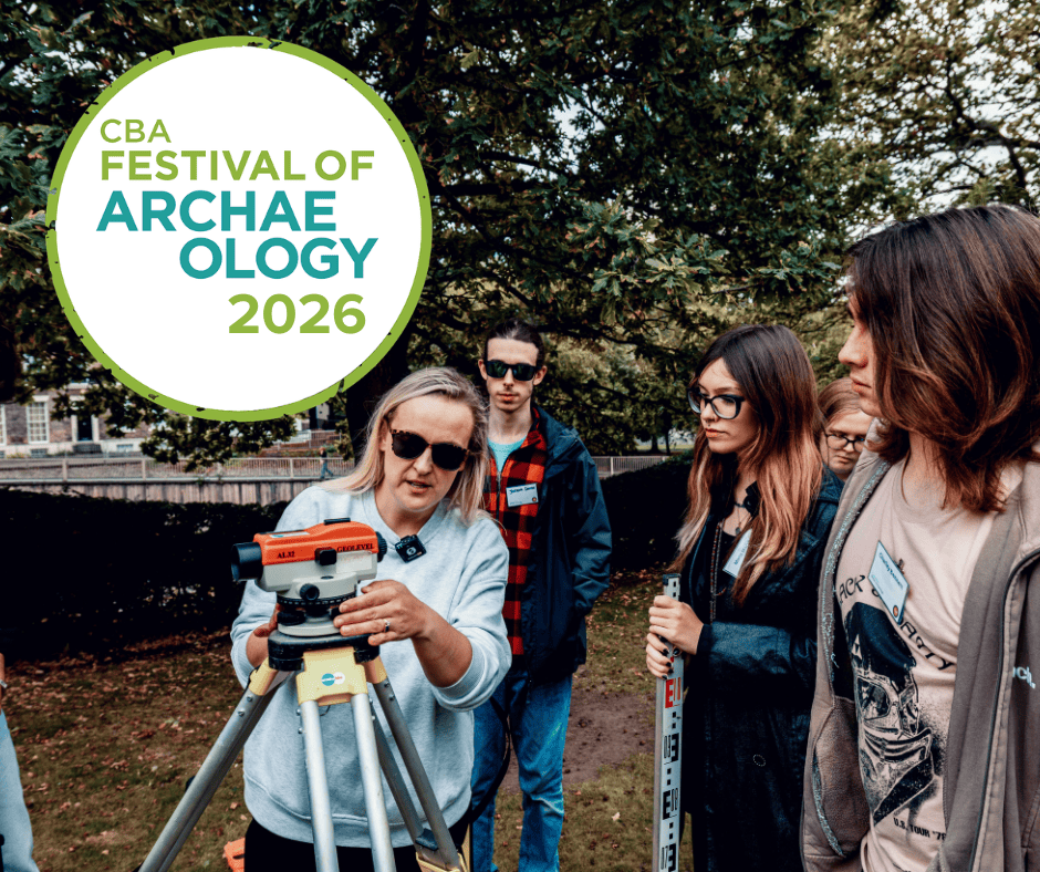 A woman demonstrates how to use a dumpy level to three young adults during a workshop on archaeological landscape survey. They are outside on a sunny autumnal day and trees are in the background. Text added to the image says: CBA Festival of Archaeology 2026.